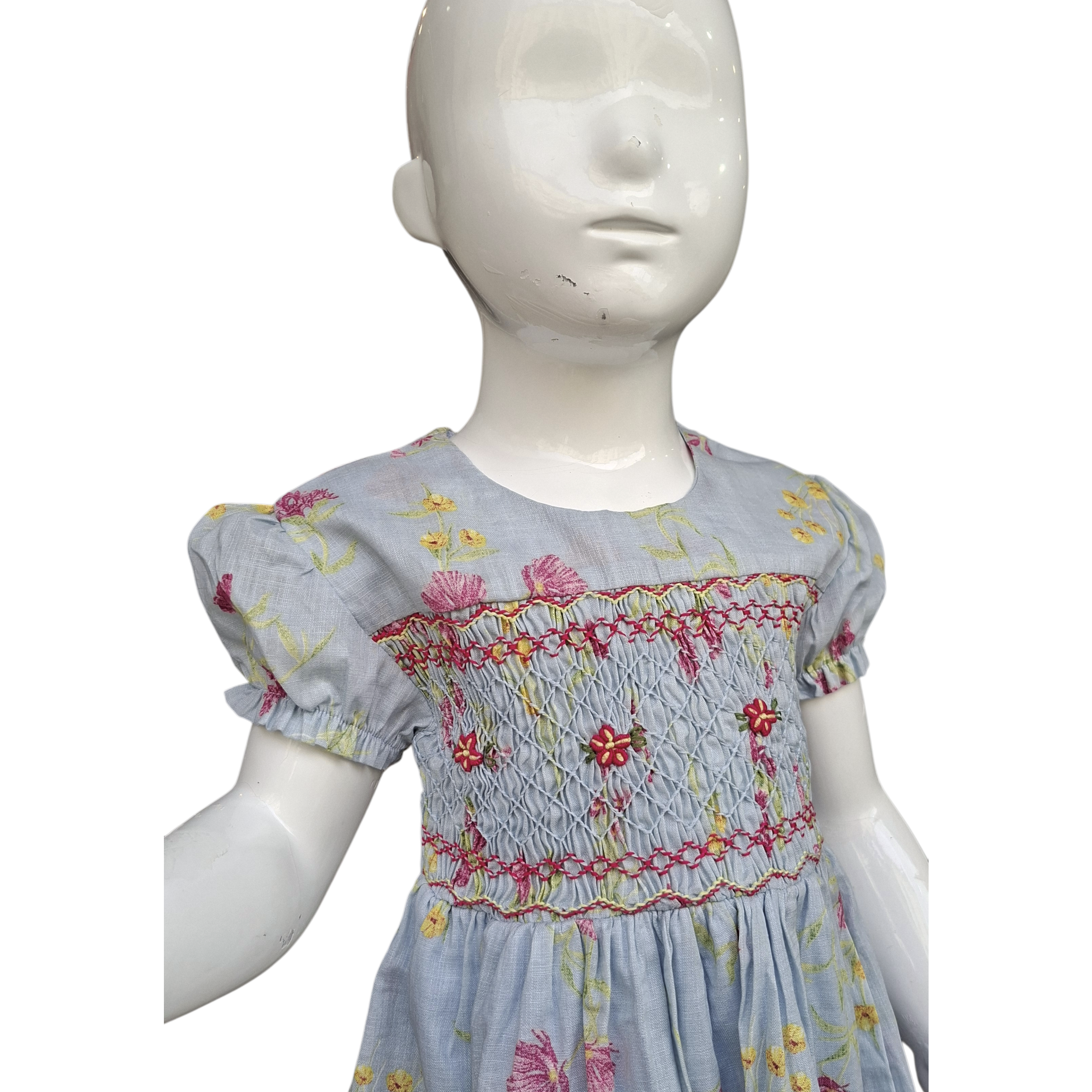 Robe à smocks fleurie bleu gris, doublée.