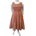 Robe à smocks orange fleuri multicolore. Tissu Goldina dress.
